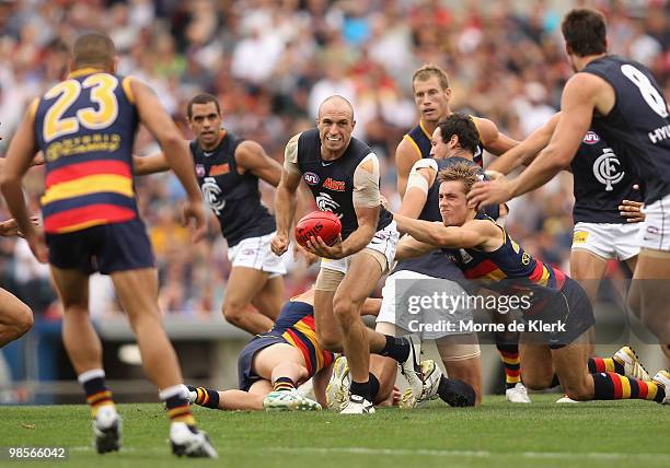 Chris Judd of the Blues handballs out of the centre during the round four AFL match between the Adelaide Crows and the Carlton Blues at AAMI Stadium...