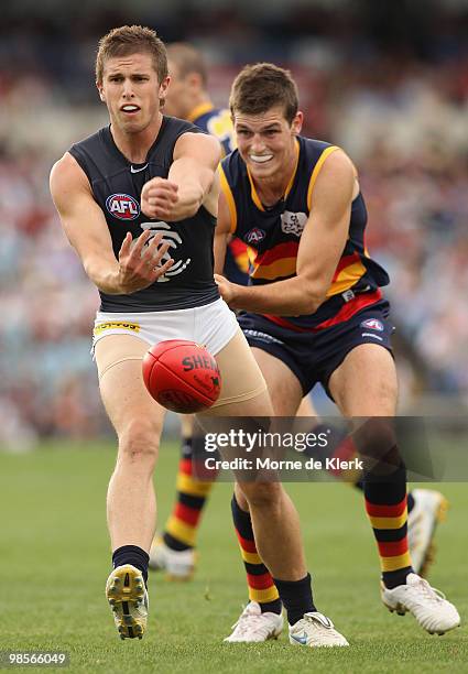 Marc Murphy of the Blues handballs during the round four AFL match between the Adelaide Crows and the Carlton Blues at AAMI Stadium on April 17, 2010...