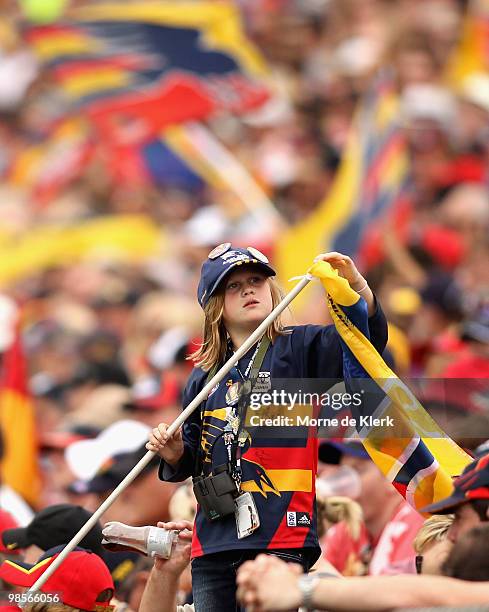 Crows fans tries to fix her broken flag during the round four AFL match between the Adelaide Crows and the Carlton Blues at AAMI Stadium on April 17,...