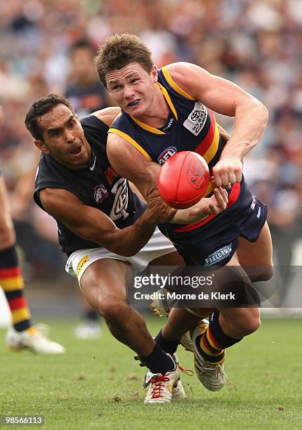 Eddie Betts of the Blues tackles Chris Schmidt of the Crows and during the round four AFL match between the Adelaide Crows and the Carlton Blues at...