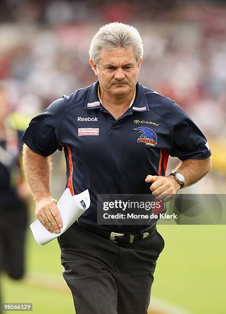 Neil Craig, coach of the Crows, runs from the ground during the round four AFL match between the Adelaide Crows and the Carlton Blues at AAMI Stadium...