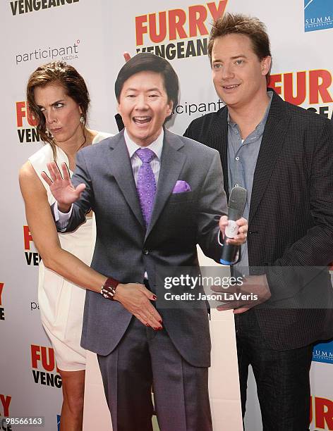 Actress Brooke Shields and actor Brendan Fraser pose with a cardboard cutout of actor Ken Jeong at the premiere of "Furry Vengeance" at Mann Bruin...