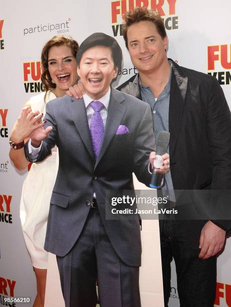 Actress Brooke Shields and actor Brendan Fraser pose with a cardboard cutout of actor Ken Jeong at the premiere of "Furry Vengeance" at Mann Bruin...