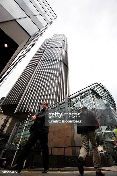 Pedestrians pass Tower 42, formerly the Nat West Tower, center, in the financial district of London, U.K., on Monday, April 19, 2010. The U.K.'s...