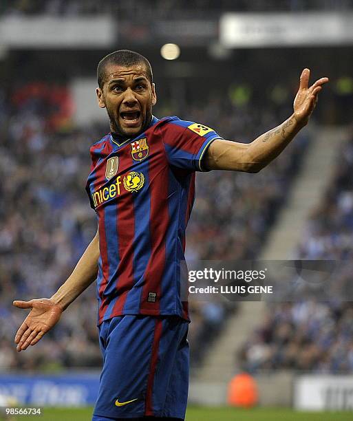 Barcelona's Brazilian defender Dani Alves reacts during a Spanish League football match against Espanyol on April 17, 2010 at the Cornella-El Prat...