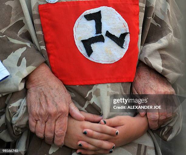 South Africans supporting the white supremacist Afrikaner Resistance Movement stand on April 6, 2010 outside a South African court in the...