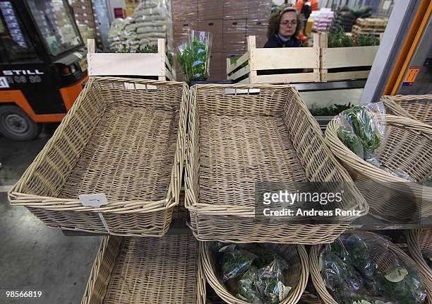 Empty baskets of coriander and basil herbage are pictured at the central market on April 20, 2010 in Berlin, Germany. Imports of foreign foods such...