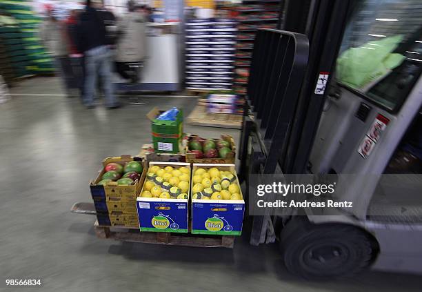 Fork lift carries boxes of fruits at the central market on April 20, 2010 in Berlin, Germany. Imports of foreign foods such as Kenyan beans, Thai...