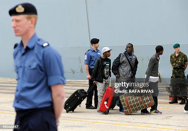 British civilians board the Albion Royal Navy ship destined for Portsmouth, on April 20 in the northern Spanish city of Santander. Britain has...