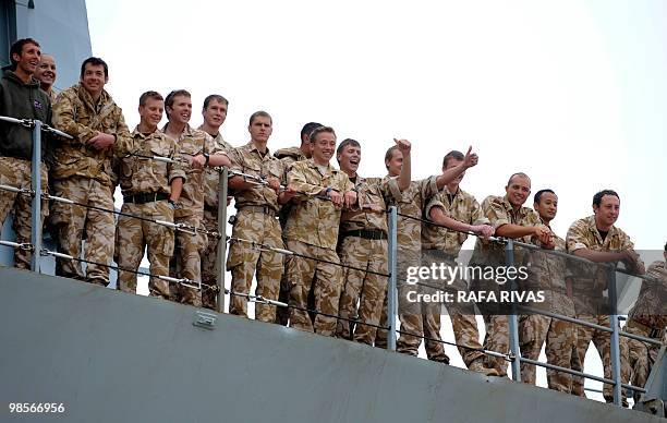 British soldiers from the 3rd Battalion "The Rifles" returning home after a six-month tour in Afghanistan smile on board of the Albion Royal Navy...