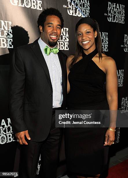 Professional Football Player Dhani Jones and Akila O'Grady pose for a photo at the exclusive viewing party for "Dhani Tackles The Globe" at Red Bull...