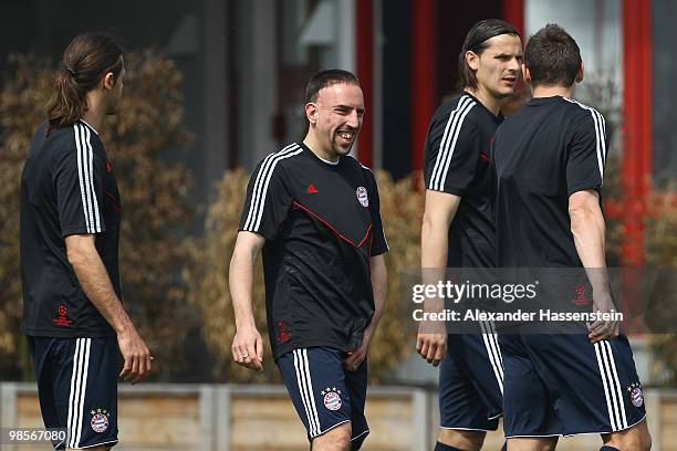 Franck Ribery jokes with his team mates Martin Demichelis , Daniel van Buyten and Miroslav Klose during the Bayern Muenchen training session at...