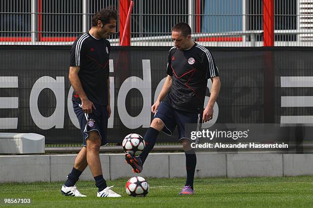 Franck Ribery and his team mate Hamit Altintop attend the Bayern Muenchen training session at Bayern's training ground 'Saebener Strasse' on April...