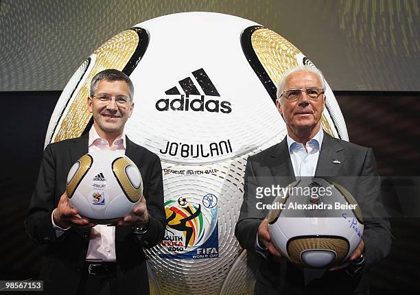 German soccer legend Franz Beckenbauer and Adidas CEO Herbert Hainer pose in front of a huge soccer ball during the presentation of the FIFA World...