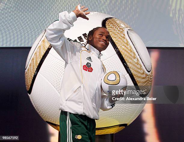 South African national football player Sphiwe Shabalala waves as he arrives for the presentation of the FIFA World Cup 2010 final match ball on April...