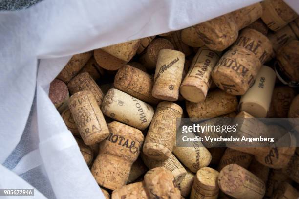 a collection of traditional cork closures (bottle corkstoppers) used for sealing wine bottles - argenberg stock pictures, royalty-free photos & images