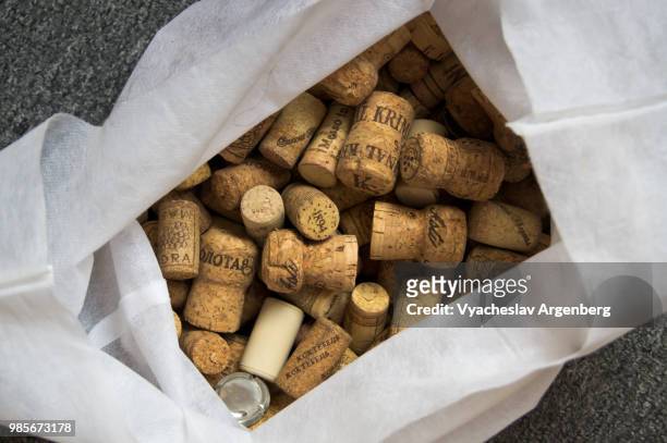 a collection of traditional cork closures (bottle corkstoppers) used for sealing wine bottles - argenberg stock pictures, royalty-free photos & images