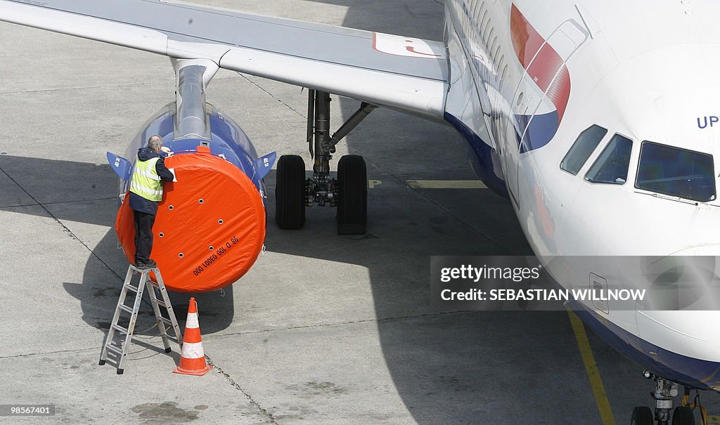 A technician controls the engine of an a