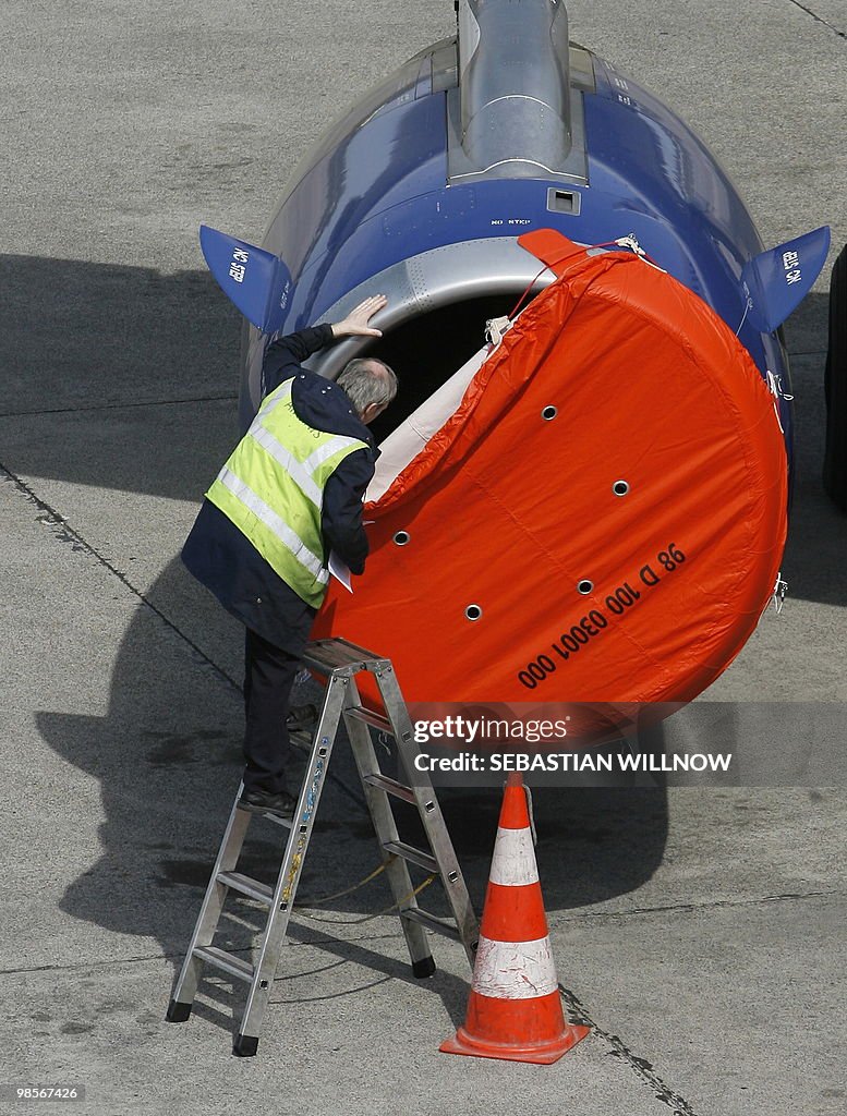 A technician controls the engine of an a
