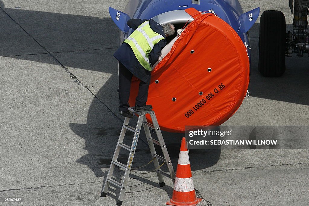 A technician controls the engine of an a