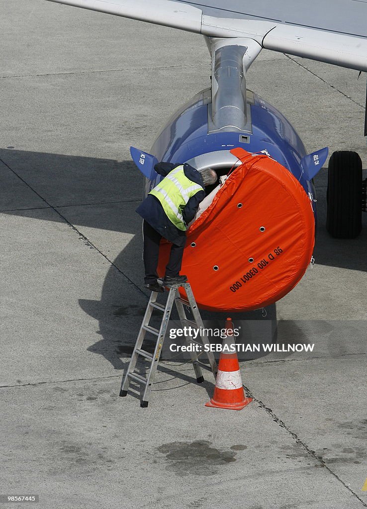 A technician controls the engine of an a