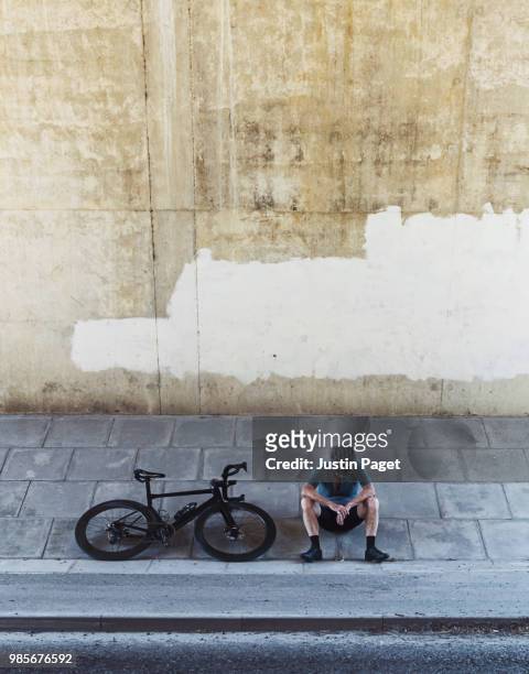 exhausted senior cyclist - bicycle tire stock pictures, royalty-free photos & images