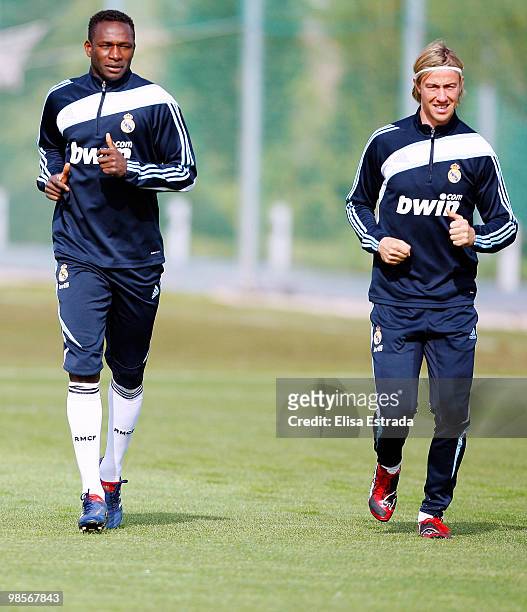 Mahamadou Diarra and Guti of Real Madrid run during a training session at Valdebebas on April 20, 2010 in Madrid, Spain.
