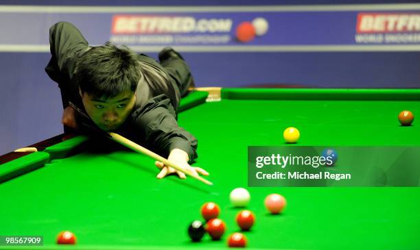 Ding Junhui of China plays a shot during the Betfred.com World Snooker Championships at the Crucible Theatre on April 20, 2010 in Sheffield, England.