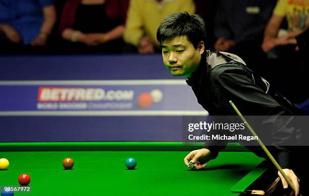 Ding Junhui of China plays a shot during the Betfred.com World Snooker Championships at the Crucible Theatre on April 20, 2010 in Sheffield, England.