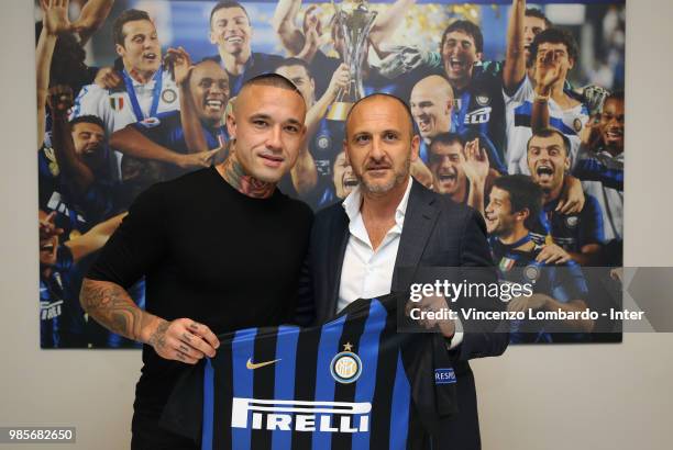 New signing for FC Internazionale Milano Radja Nainggolan signs his contract with Sportif Director of FC Internazionale Milano Piero Ausilio at FC...