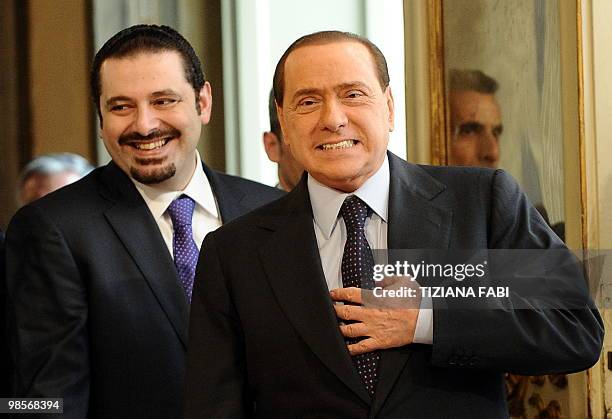 Italian Prime Minister Silvio Berlusconi arrives with his Lebanese counterpart Saad Hariri prior their meeting on April 20, 2010 at Palazzo Chigi in...