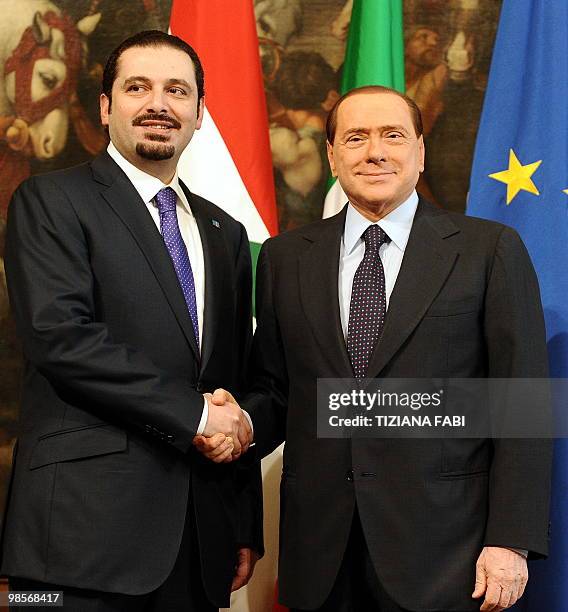 Italian Prime Minister Silvio Berlusconi poses with his Lebanese counterpart Saad Hariri prior their meeting on April 20, 2010 at Palazzo Chigi in...