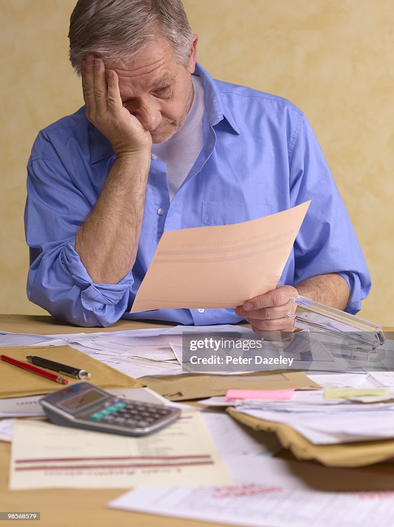 Senior man doing tax return