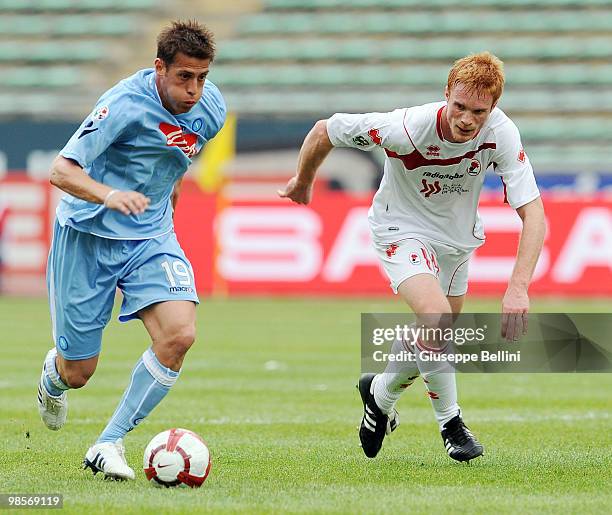 German Dennis of Napoli and Alessandro Gazzi of Bari in action during the Serie A match between AS Bari and SSC Napoli at Stadio San Nicola on April...