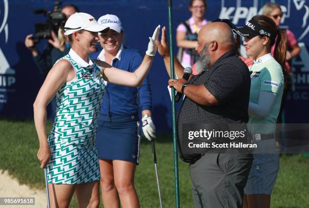 Sarah Jane Smith of Australia gets a high-five from announcer Michael Collins during the player showcase prior to the start of the KPMG Women's PGA...