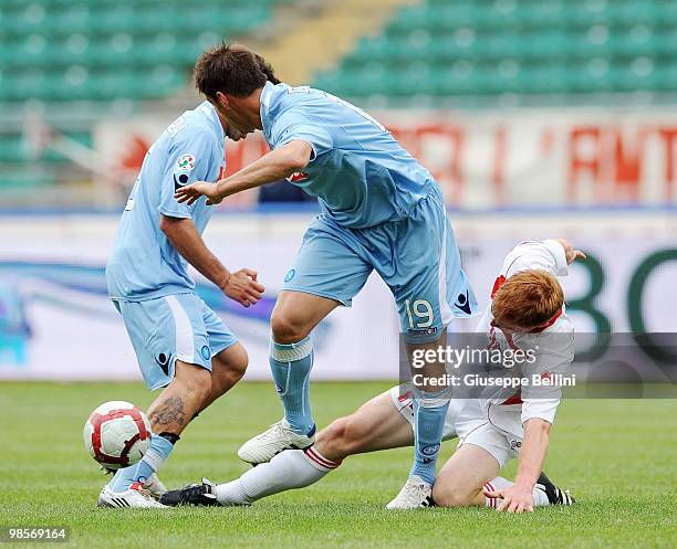 German Dennis of Napoli and Alessandro Gazzi of Bari in action during the Serie A match between AS Bari and SSC Napoli at Stadio San Nicola on April...