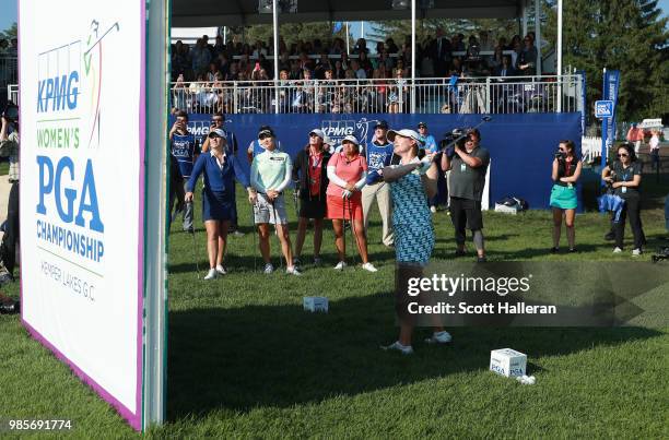 Sarah Jane Smith of Australia plays a shot over a wall during the player showcase prior to the start of the KPMG Women's PGA Championship at Kemper...