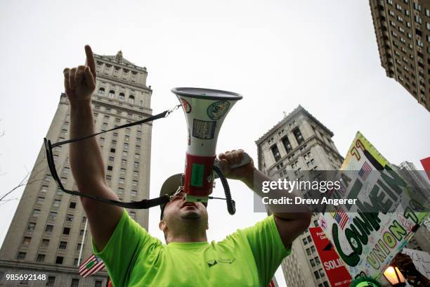 Union activists and supporters rally against the Supreme Court's ruling in the Janus v. AFSCME case, in Foley Square in Lower Manhattan, June 27,...