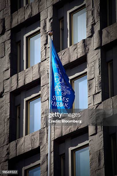 Flag flies outside the headquarters of the Swedish Central Bank sit in Stockholm, Sweden, on Monday, April 19, 2010. Sweden's krona gained to the...