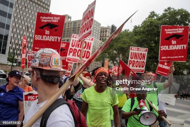 Union activists and supporters rally against the Supreme Court's ruling in the Janus v. AFSCME case, in Foley Square in Lower Manhattan, June 27,...