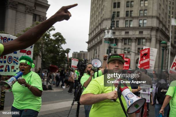 Union activists and supporters rally against the Supreme Court's ruling in the Janus v. AFSCME case, in Foley Square in Lower Manhattan, June 27,...