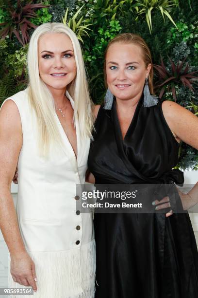 Caroline Mellor and Erica Bergsmeds attend a private view of photographer Erica Bergsmeds exhibition on June 27, 2018 in London, England.