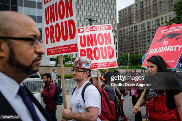 Union activists and supporters rally against the Supreme Court's ruling in the Janus v. AFSCME case, in Foley Square in Lower Manhattan, June 27,...