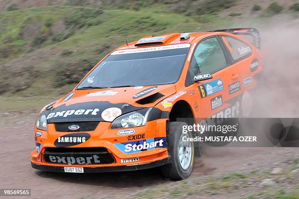 Henning Solberg of Norway and co-pilot Ilka Minor of Austria compete in their Ford Focus during the first day of the Rally of Turkey on April 16,...