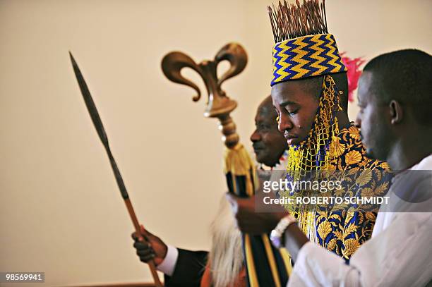 Ugandan King Oyo Nyimba Kabamba Iguru Rukidi IV walks moments before he is escorted by the Ugandan President Yoweri Museveni during the crowning...