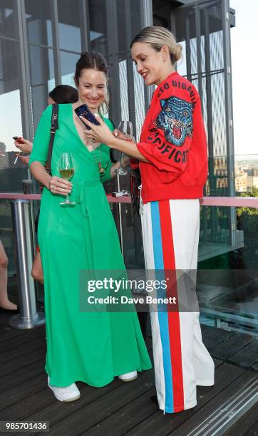 Ashley Roberts and guest attends the opening of new rooftop bar Savage Garden on June 27, 2018 in London, England.