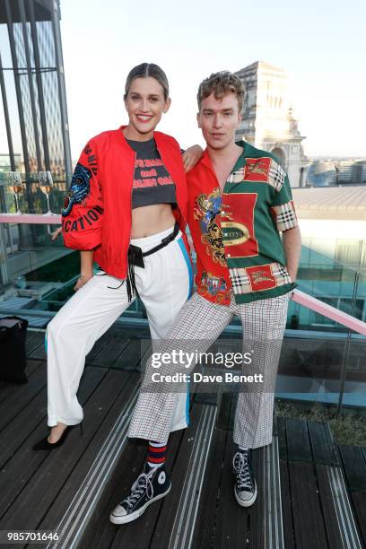 Ashley Roberts and Cowan Fletcher attend the opening of new rooftop bar Savage Garden on June 27, 2018 in London, England.