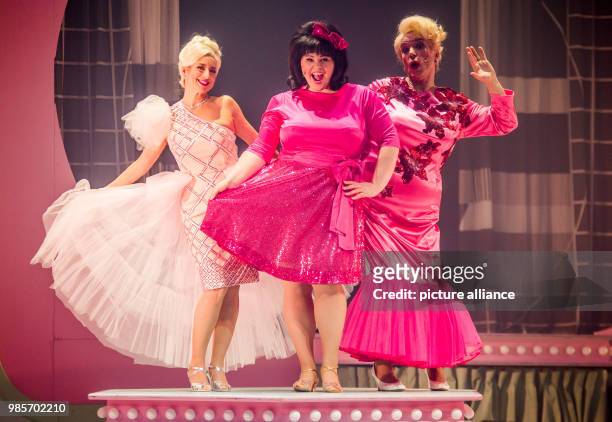 The actors and musical performers Isabel Varell , Beatrice Reece and Uwe Kroeger stand on stage during the German premiere of the new production of...
