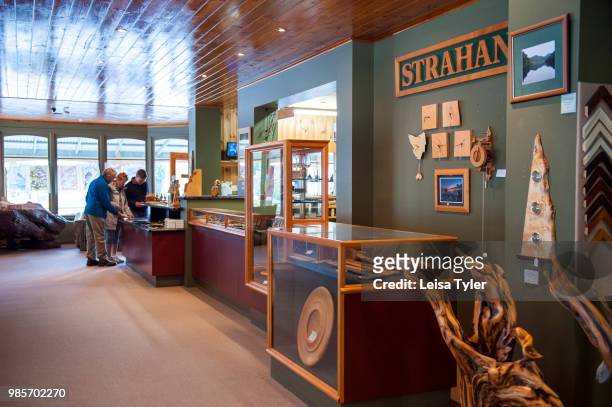 Tourists inside Wilderness Woodworks gallery, a mill specializing in Huon Pine in Strahan, Tasmania. The tree is native to south west Tasmania and...