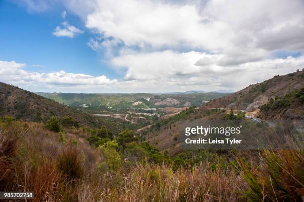 The hills driving into Queenstown, former dense rain forest now a "moonscape" due to deforestation and smelter fumes, on Tasmania's West Coast,...